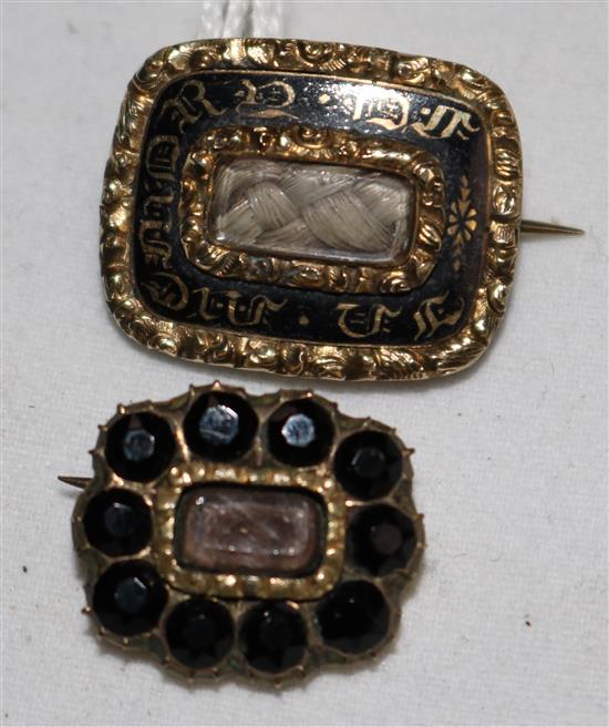 A William IV gold and black enamel mourning brooch and one other mourning brooch.